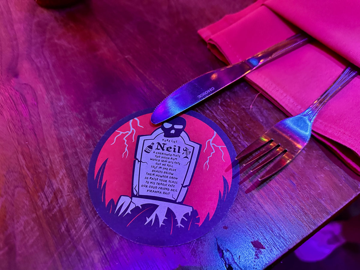 coaster with gravestone design and silverware